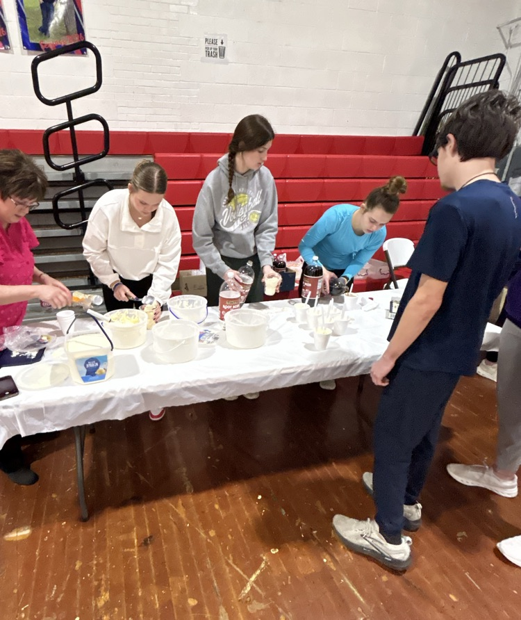 FBLA Advisor and Officers serving floats