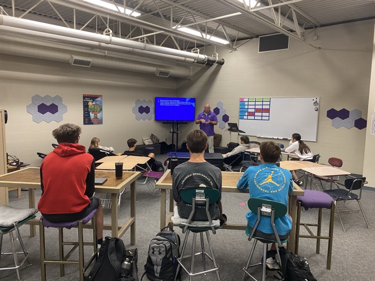 Mr. Minneman presenting to class
