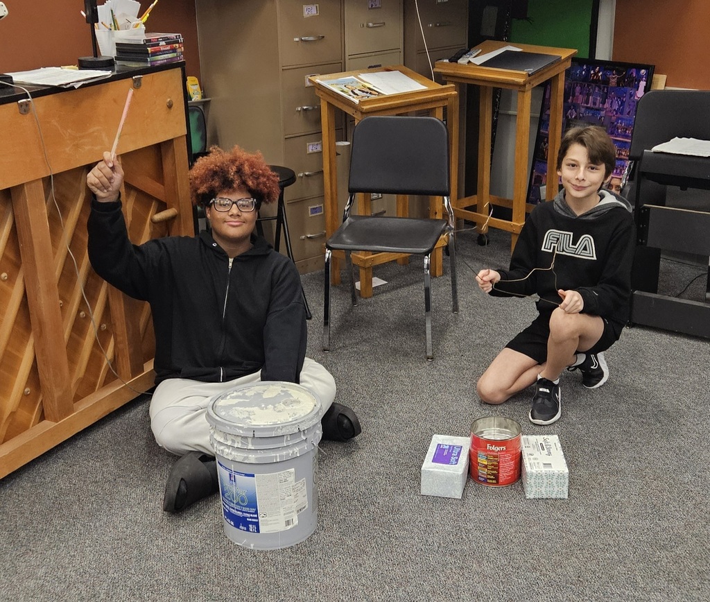 bucket and stir stick, kleenex boxes, metal hangers and can of nails