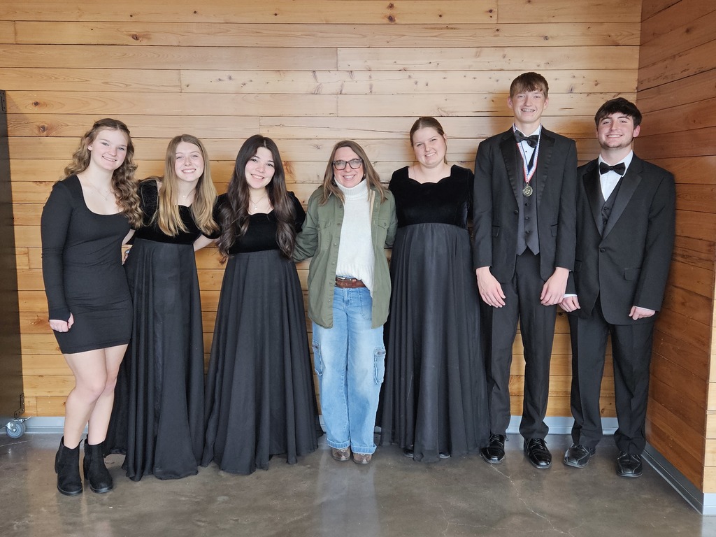 Choir kids and proud teacher