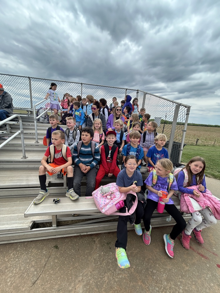 1st and 2nd grade 5 mile walkers/runners cheering on the Lady Trojans!