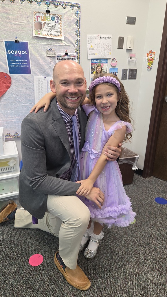 Mr. Brown read to the first graders. Claire was so happy!