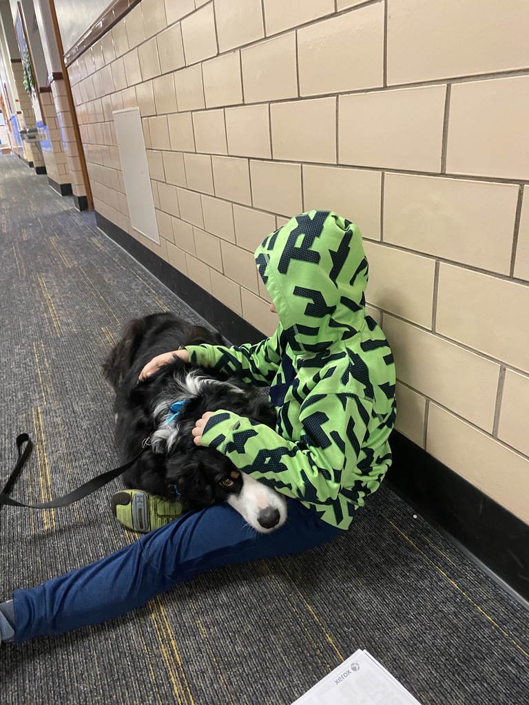 Jag helping HGS student regulate in the hallway