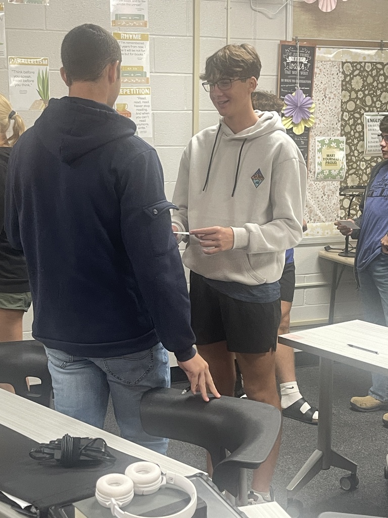 Students sharing information.