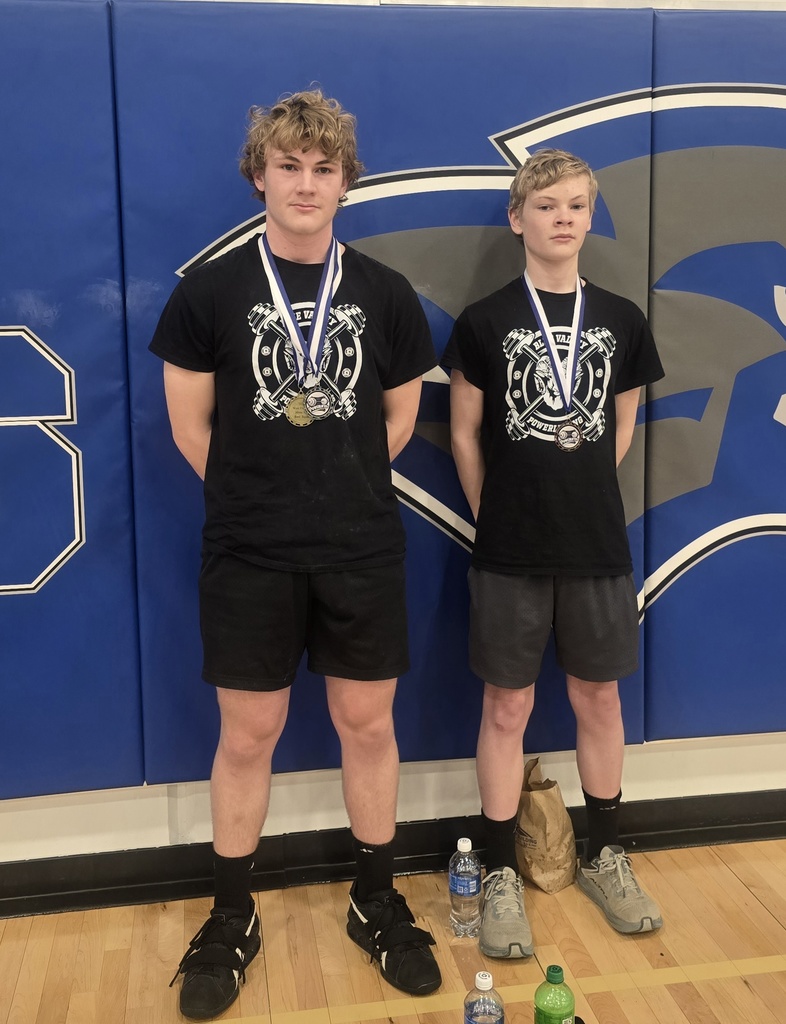 Ben and Sam with their medals for the day.