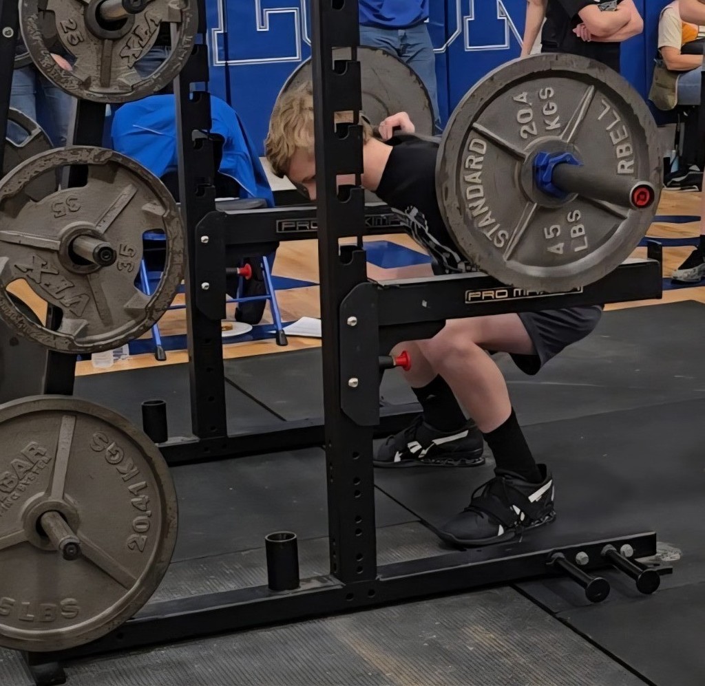 Sam Klocke warming up on Squat.