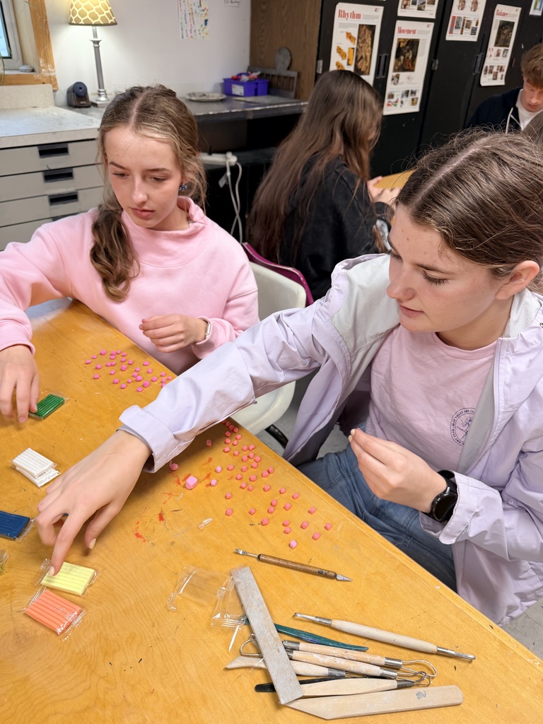 Ella and Anna working on their Minecraft mini-sculptures