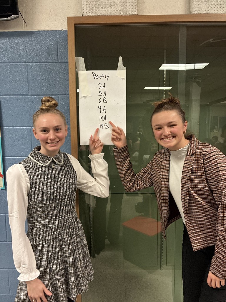 Emma and Eliana with their finals qualification poster