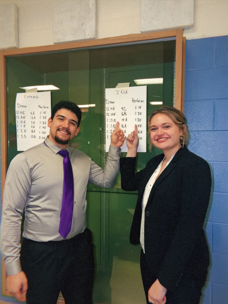 Mason and Haylee with their finals qualification poster