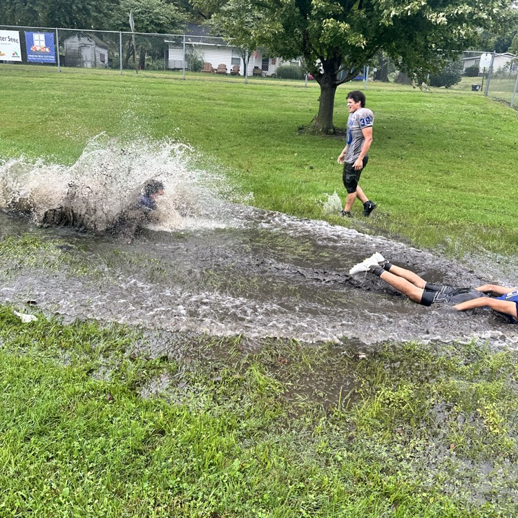 football practice in the rain