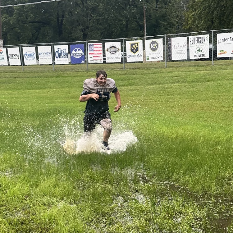 football practice in the rain