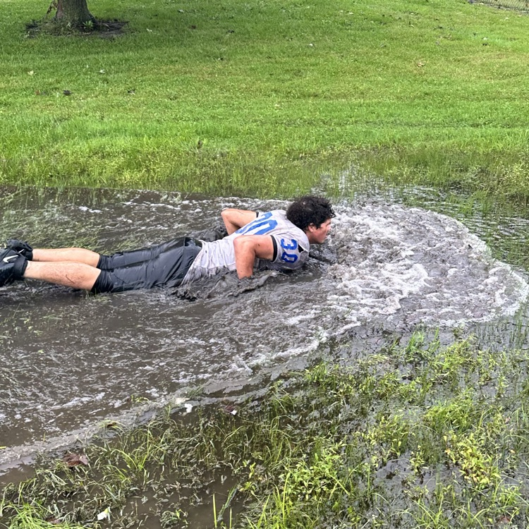 football practice in the rain