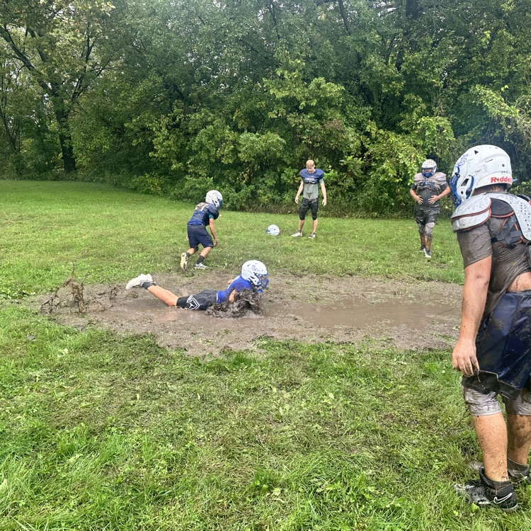 football practice in the rain