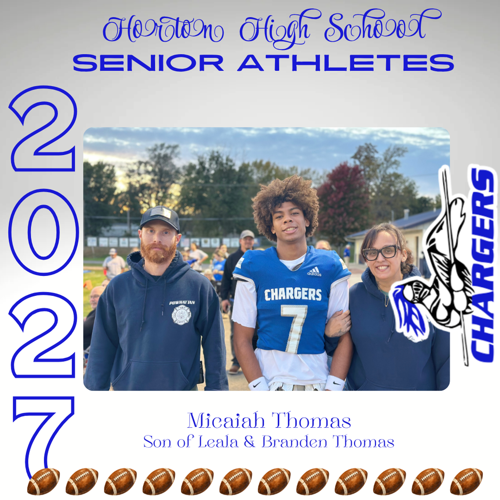 Three people pose in front of a football field. A man stands with a child and woman.