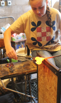 Glass blowing field trip - students shaping glass
