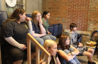 Glass blowing field trip - students shaping glass