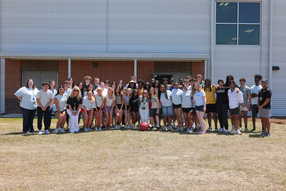group photo of IB students and teachers