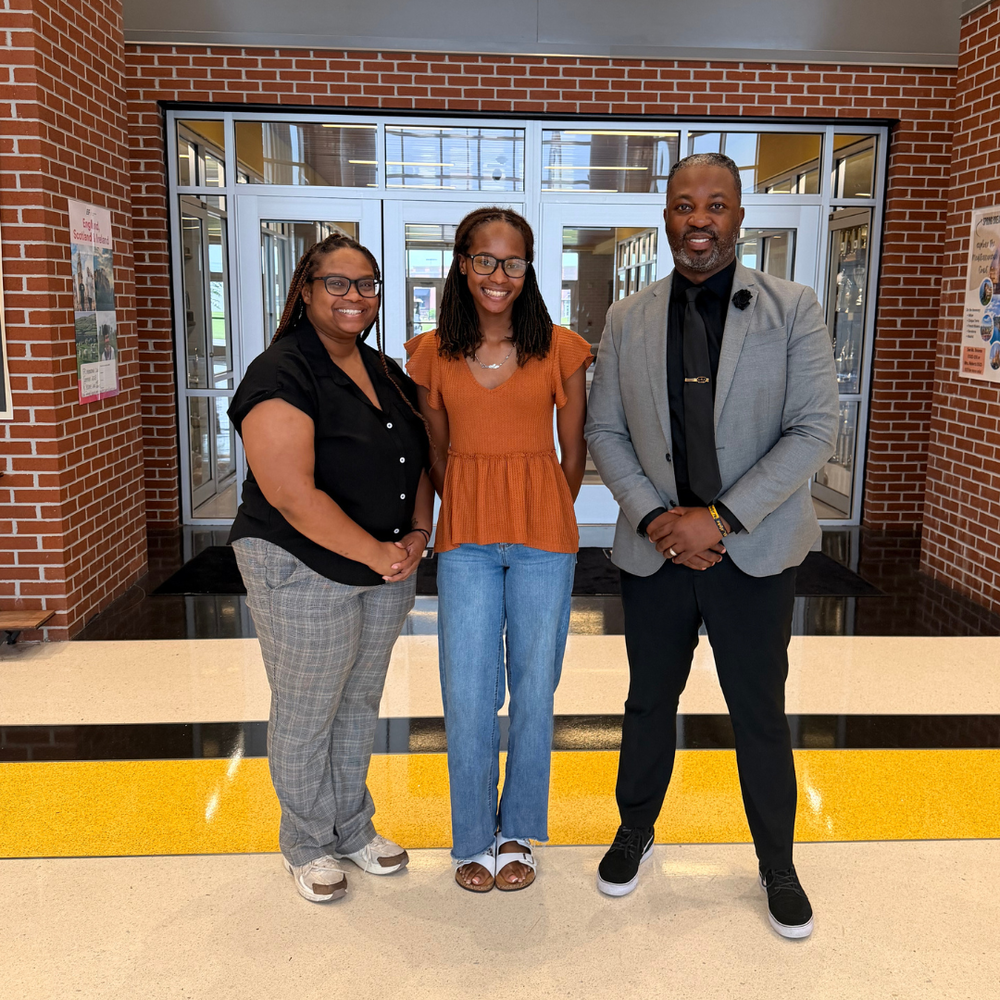 Malia with her mom and Principal Dr. Marshall