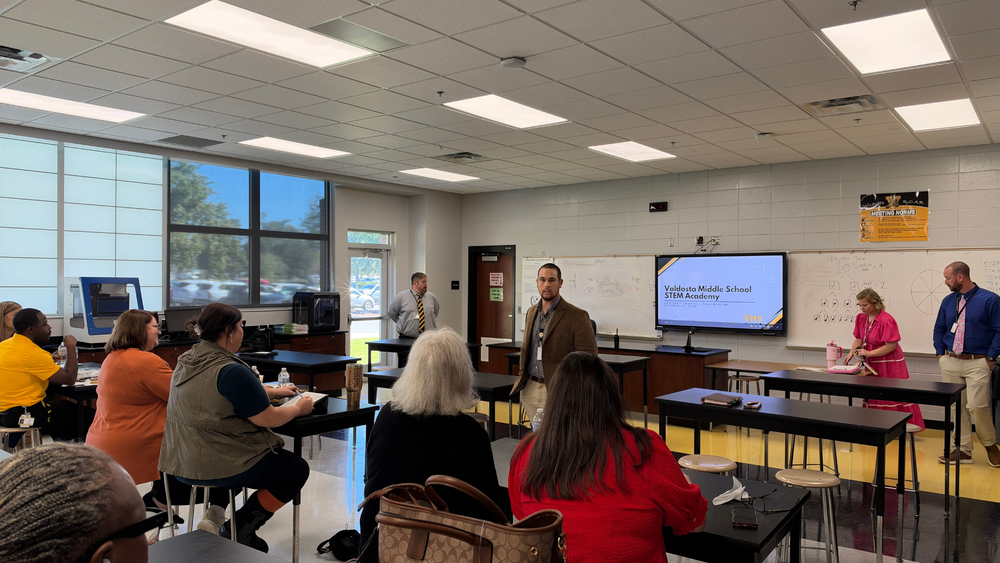 Photo of lab filled with seated participants as Mr. Crosby is presenting at the front