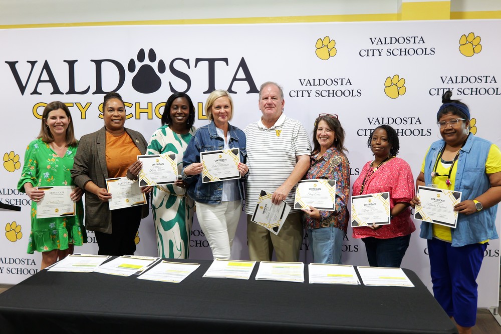 group photos with certificates