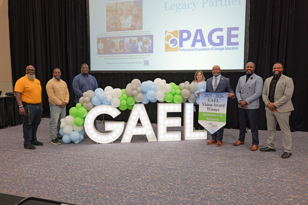 Group photo in front of GAEL letters and balloon display