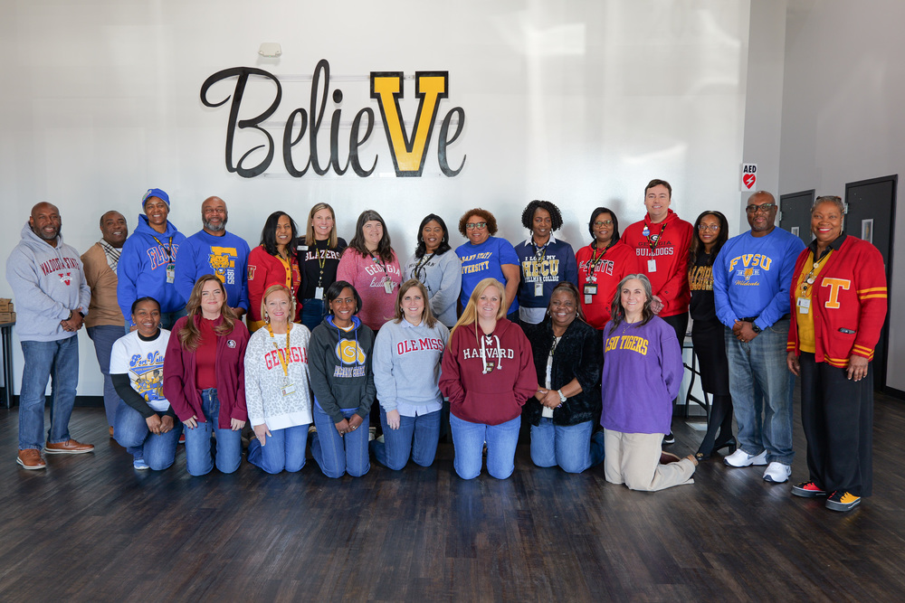 Group photo of participants in college attire