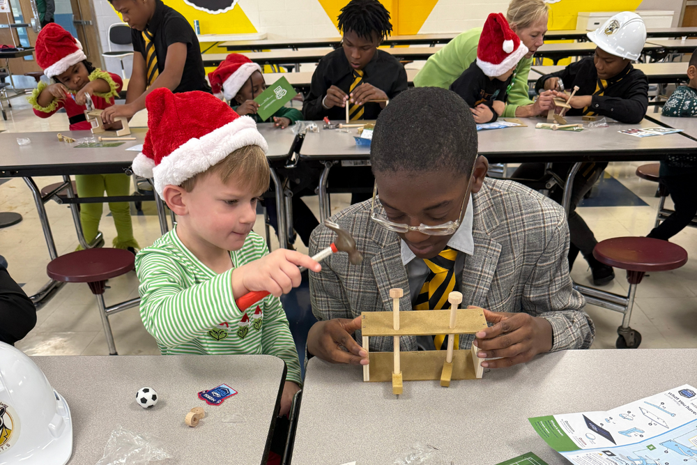 Two students working on a wooden project