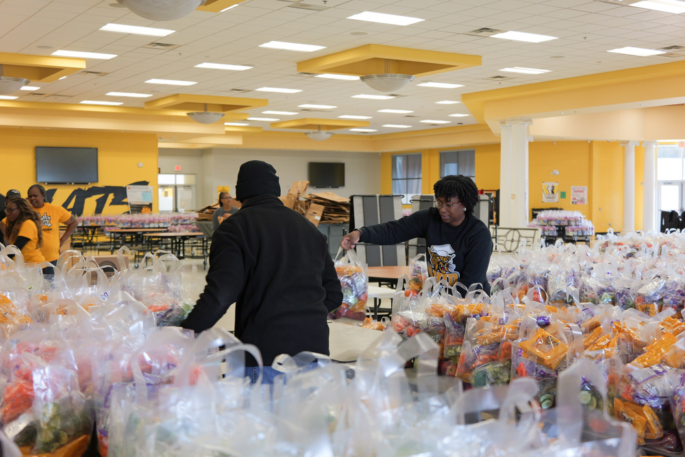 Volunteers sorting food bags at distribution