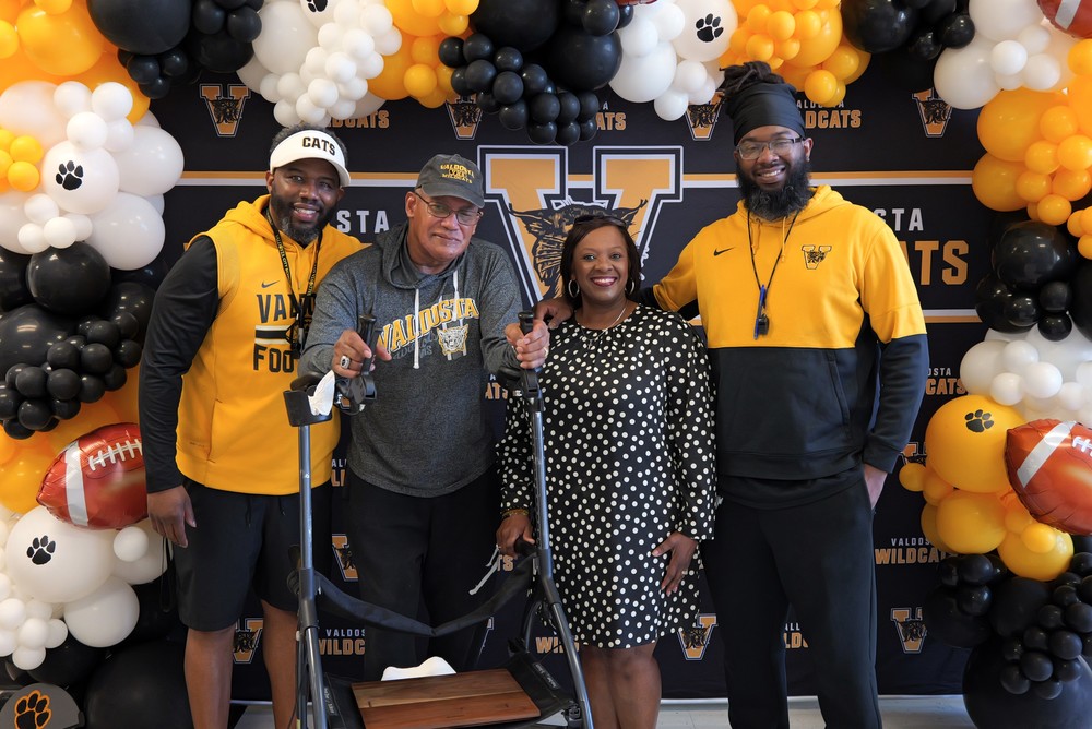 Jay Rome with parents and Dr. Coach Felton