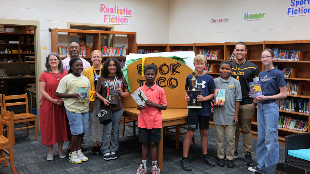 Group photo of winners with admin