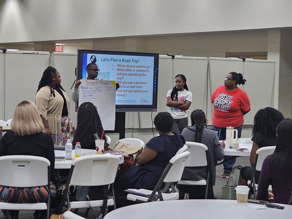 participants speaking in front of the room