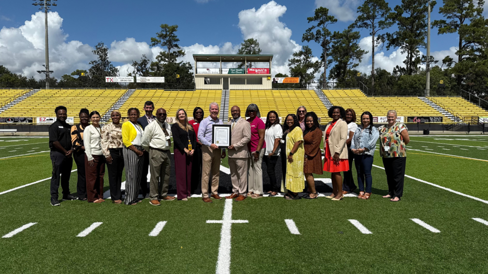 group photo of school and city officials