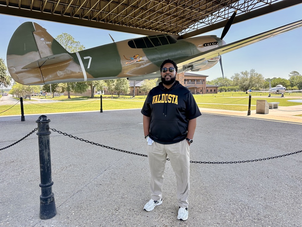 Mr. Thomas standing in front of airplane at Moody AFB