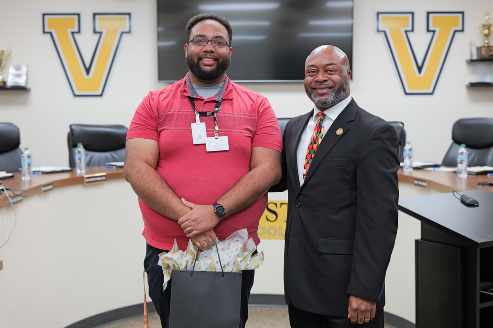 Matt holding gift bag with superintendent