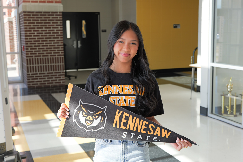 Amelia holding pennant for Kennesaw State