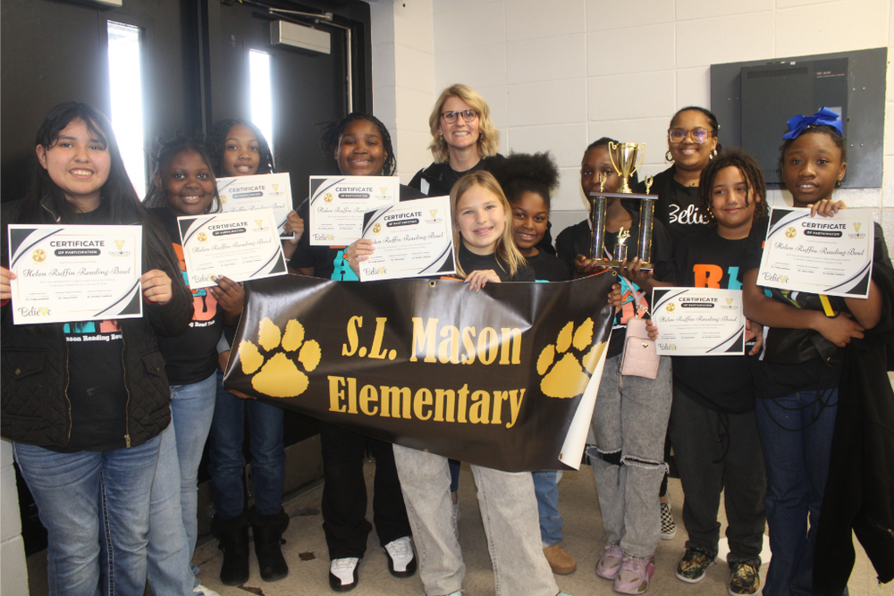 Group photo with trophy and holding certificates - SLM