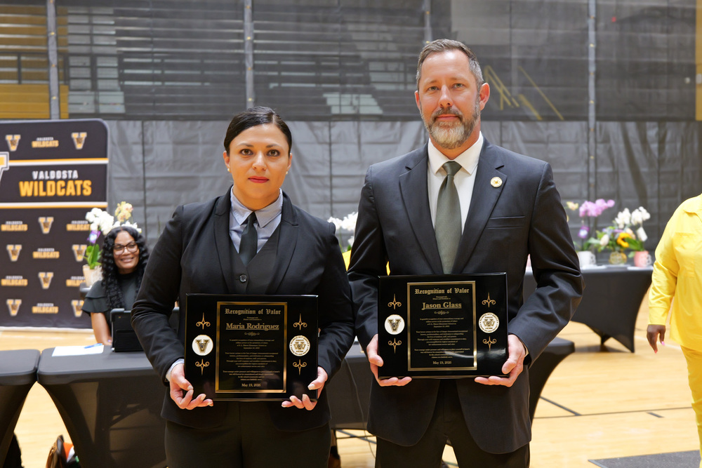 the two honorees with their plaques