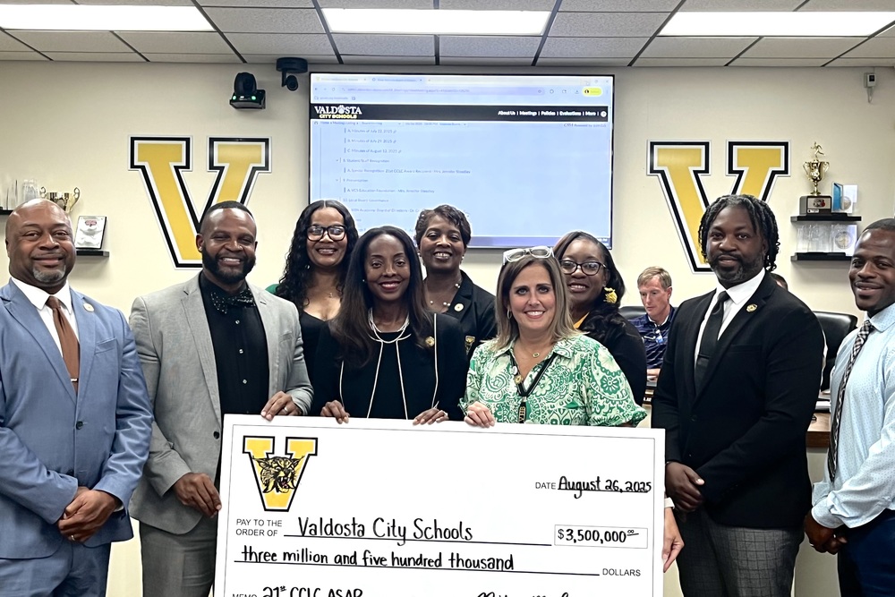 group photo with check for $3,500,000