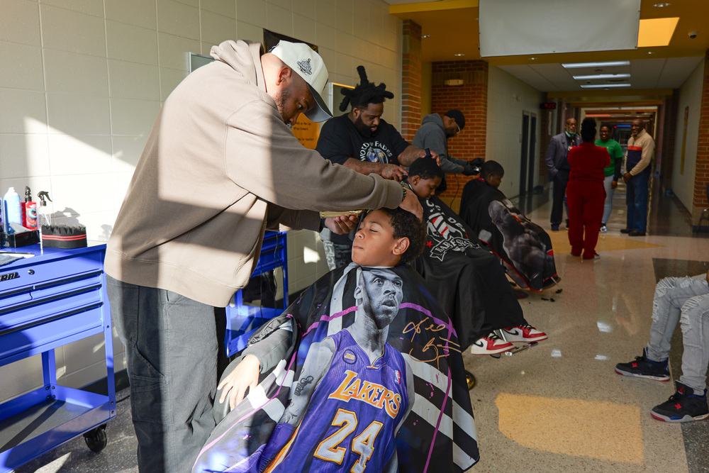 student getting his hair cut