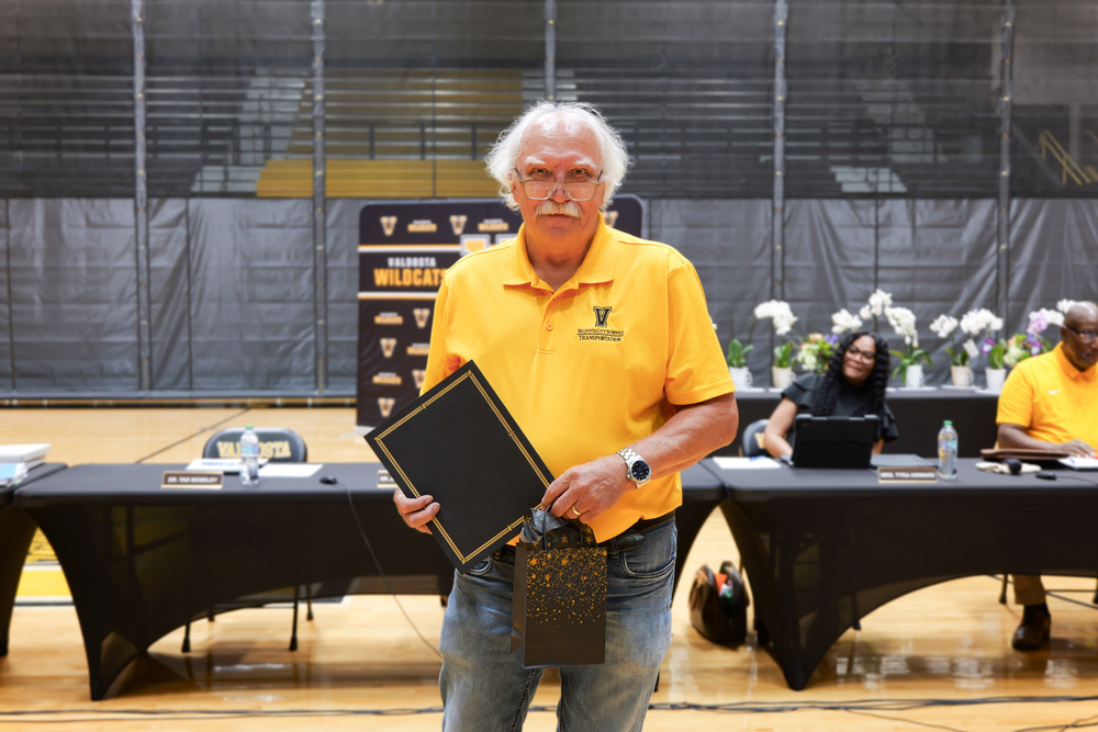 Mr. Snell, holding present and certificate