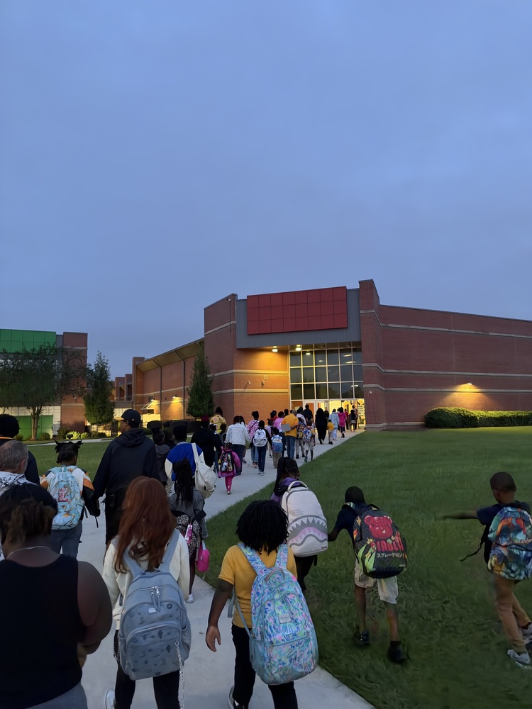 kids and parents and staff walking up to the gym