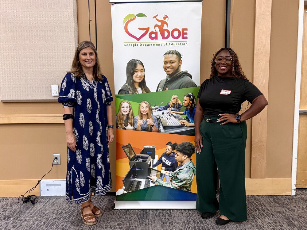 Mrs. Goff and Ms. Lewis standing in front of GaDOE sign