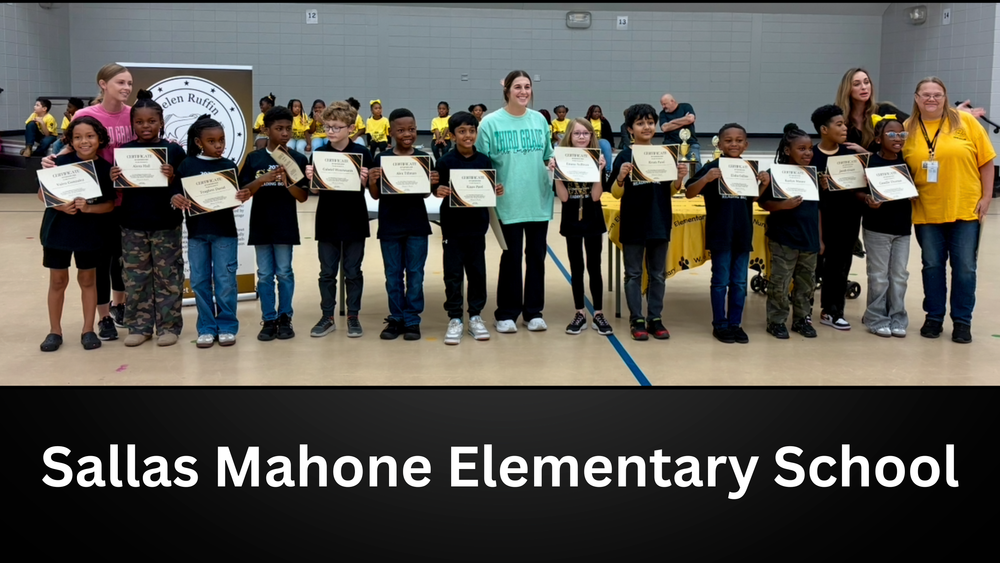 Winning team holding certificates for Sallas Mahone