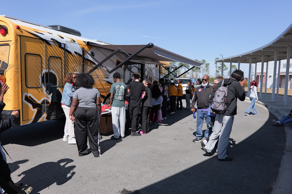 group of students and adults at the WOW bus