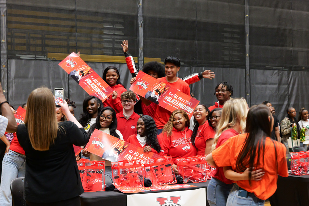 group photo of students, holding posters for VSU
