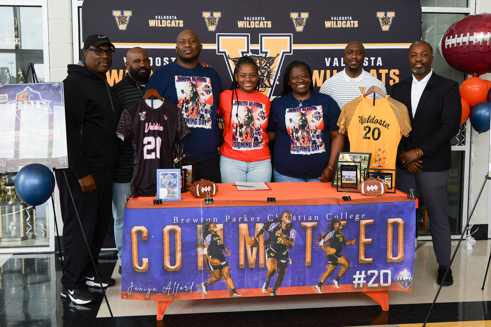 group photo of Janiya with parents and VCS Staff
