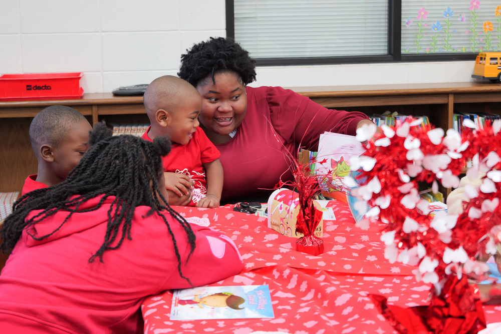 family reading a book together