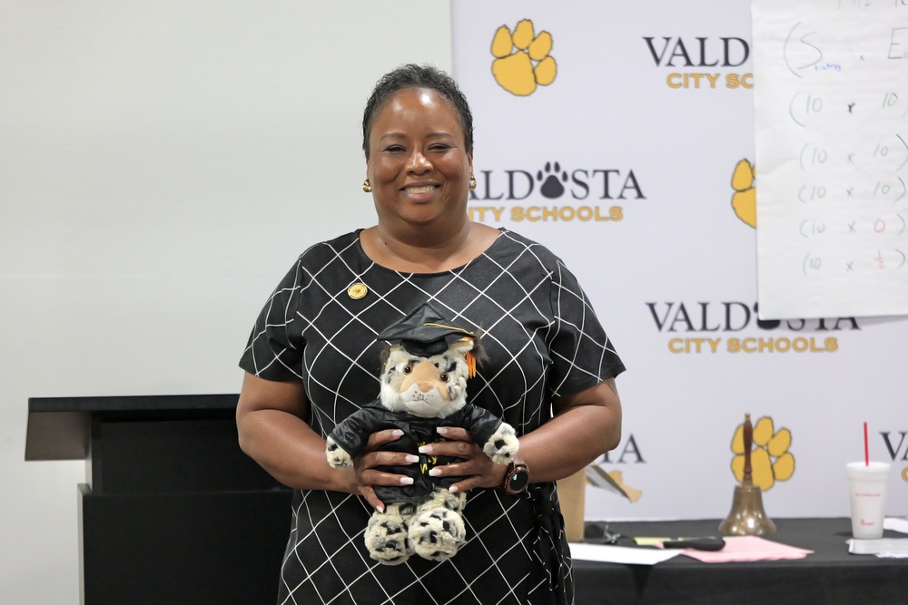 Ms. Walker holding Willie the Wildcat