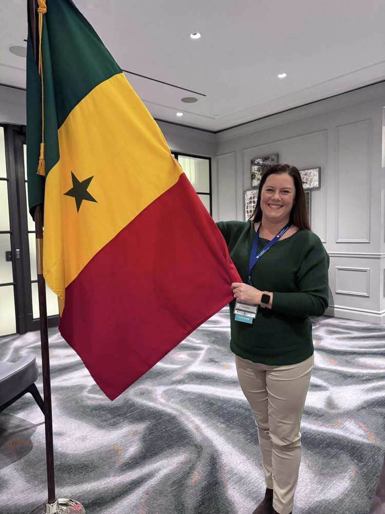 Teacher holding up flag