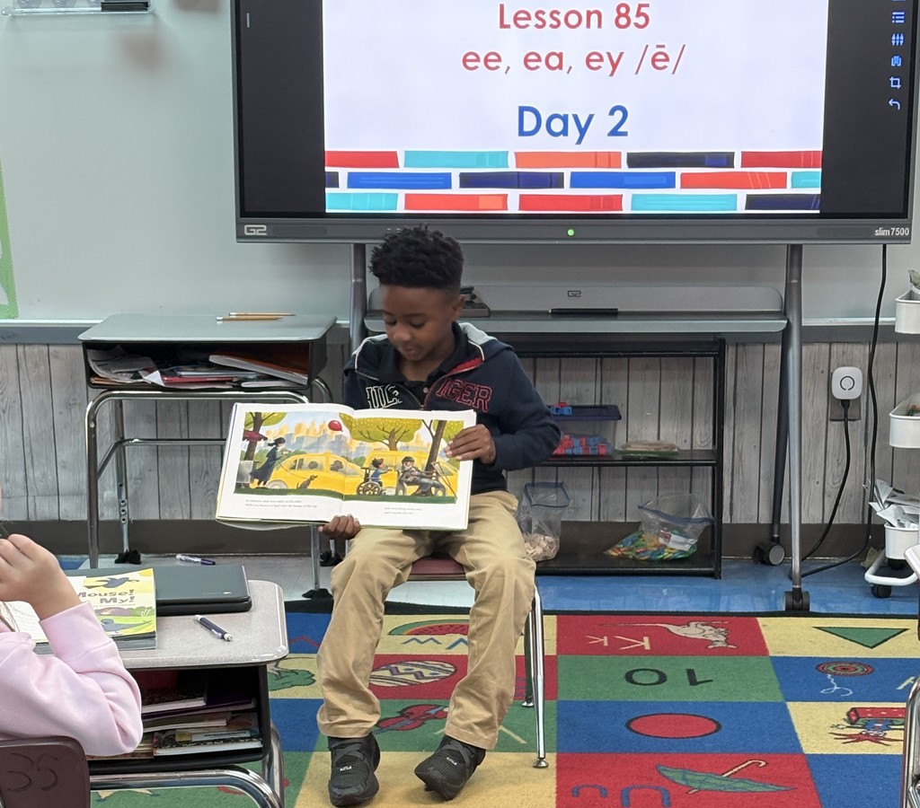 Student reading to the class